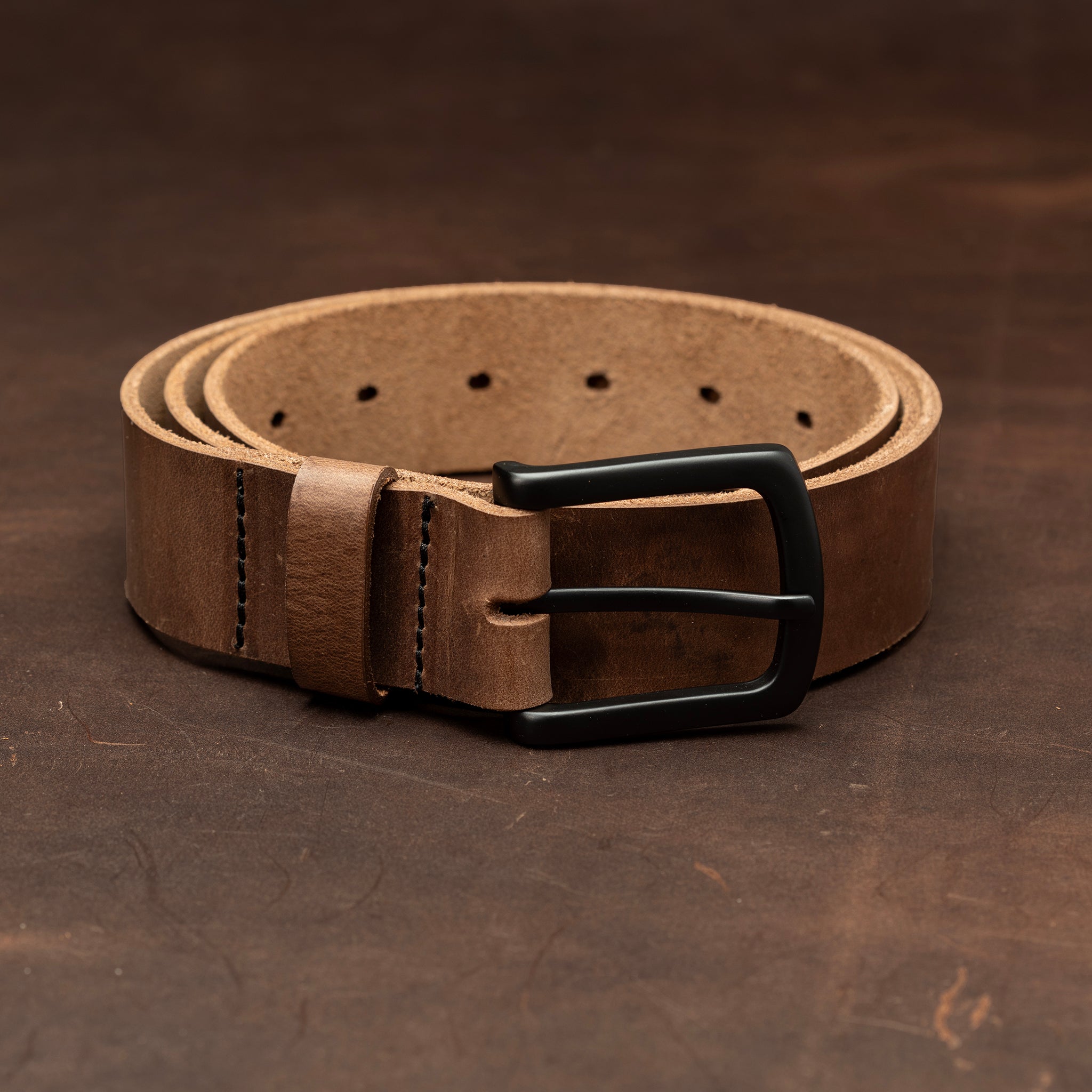 Dark brown leather belt with black buckle