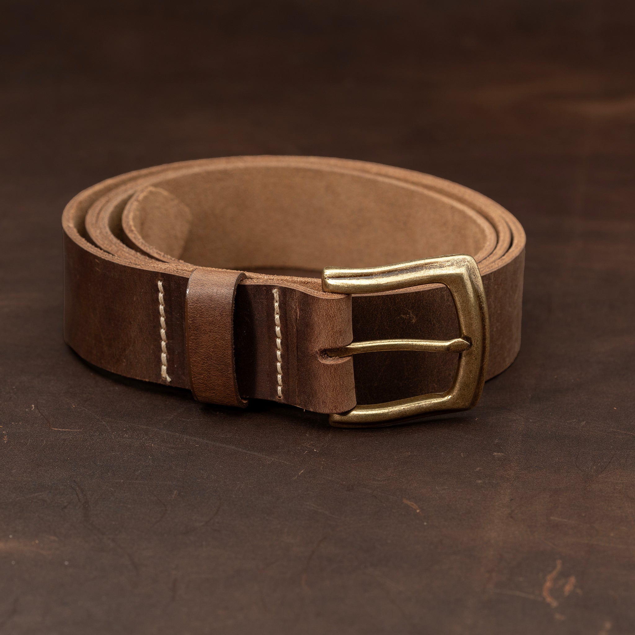 Dark brown leather belt with brass buckle