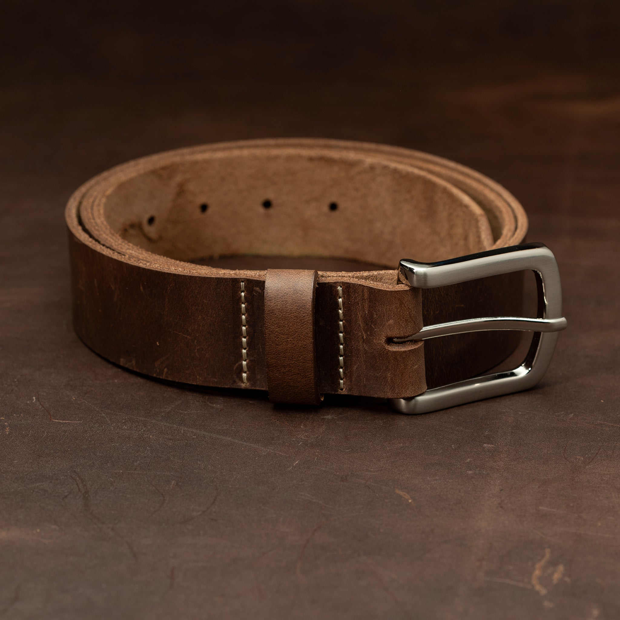 Dark brown leather with nickel buckle