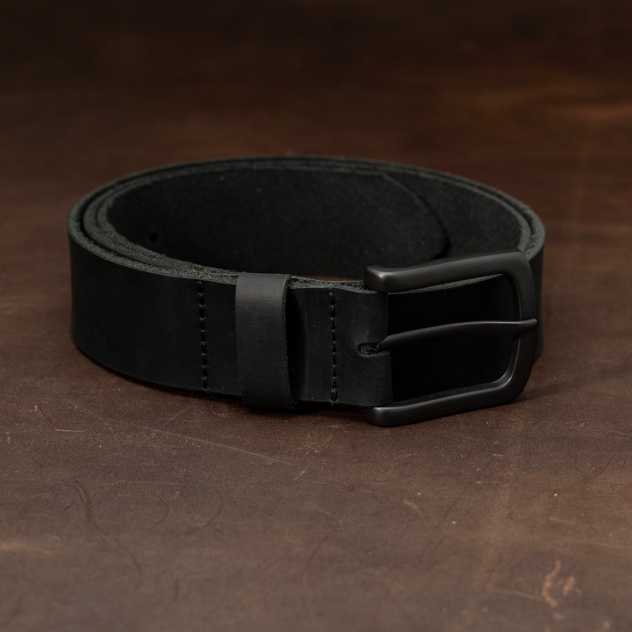 Black leather belt with black buckle