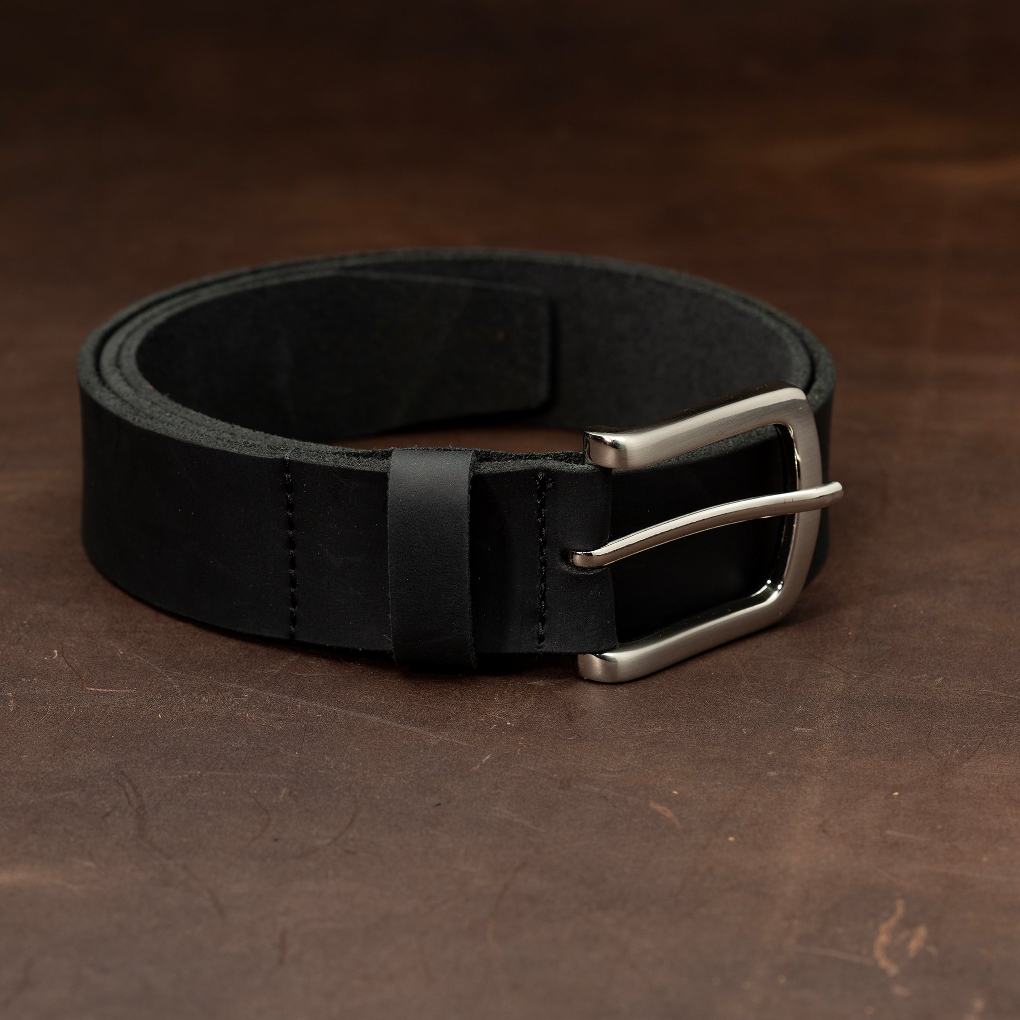Black leather belt with nickel buckle